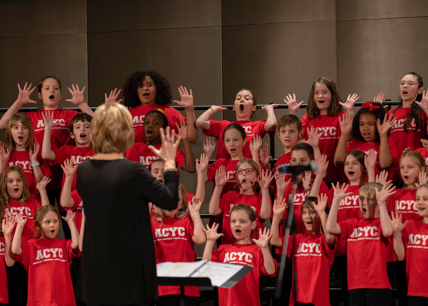 Angelica Cantanti Youth Choirs kids singing in red shirts